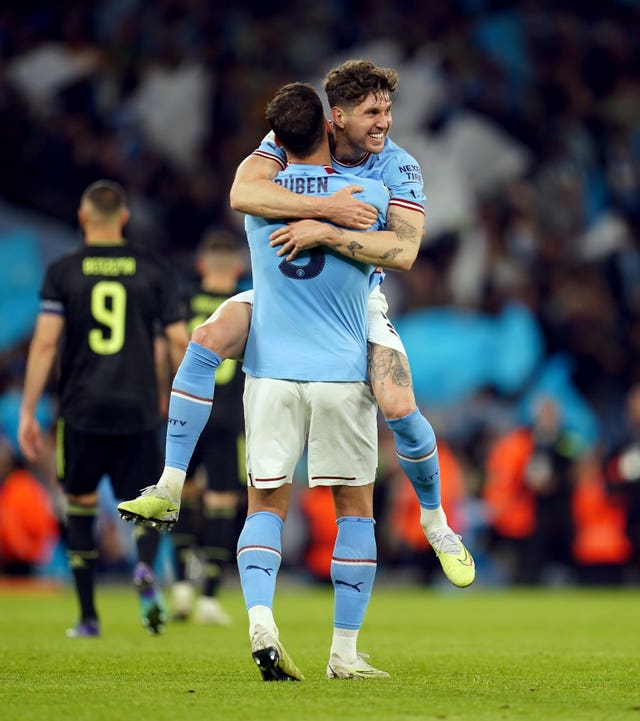 John Stones and Ruben Dias celebrate after Manchester City beat Real Madrid