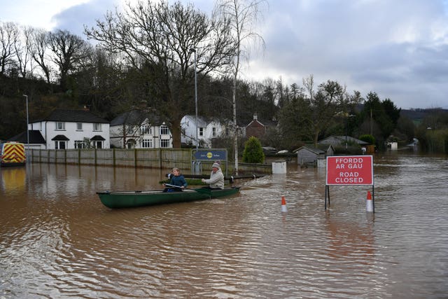 Residents took to the flooded water in Monmouth (Ben Birchall/PA).