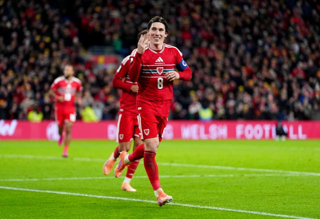 Harry Wilson celebrates his hat-trick for Wales