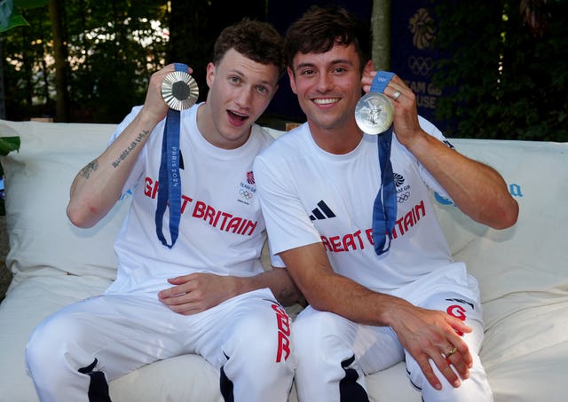 Noah Williams, left, and Tom Daley pose with their Olympic silver medals