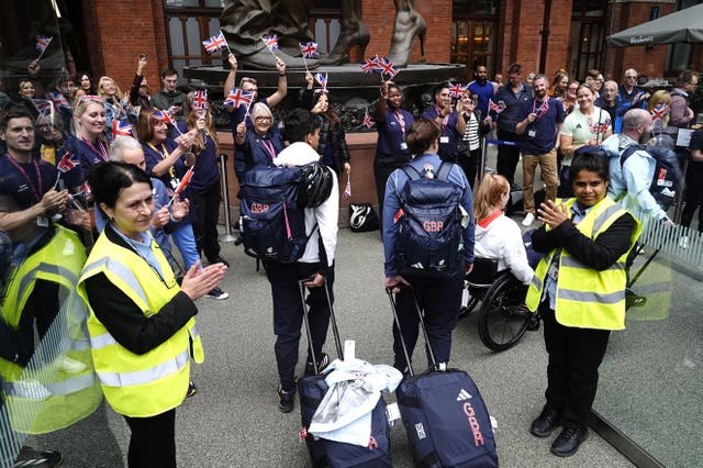 Fans applaud members of the Great Britain team at St Pancras