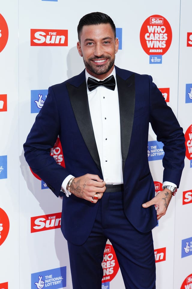 Giovanni Pernice in a tuxedo on the red carpet 