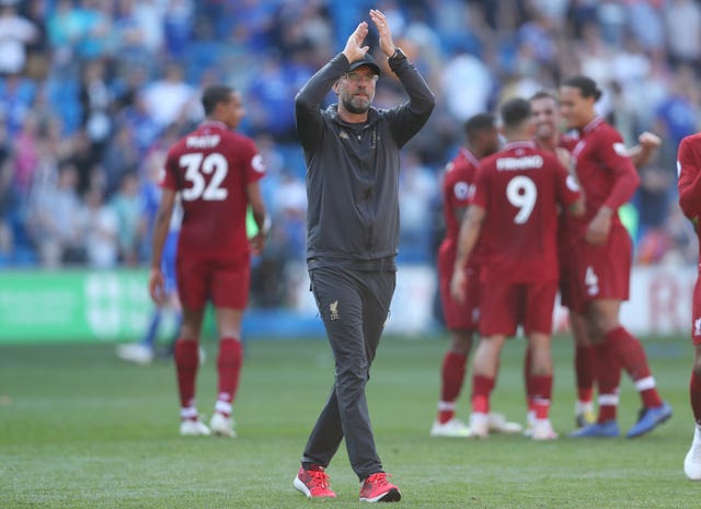 Manager Jurgen Klopp celebrates on the pitch after Liverpool's 2-0 win at Cardiff 