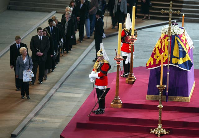 Mourners filing past the coffin of Queen Elizabeth, the Queen Mother, in Westminster Hall in 2002 