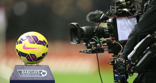 A TV camera films a close up of a Premier League football