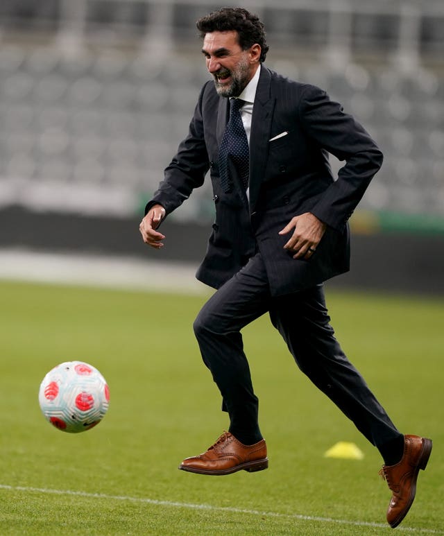 Newcastle chairman Yasir Al Rumayyan plays on the pitch at St James' Park