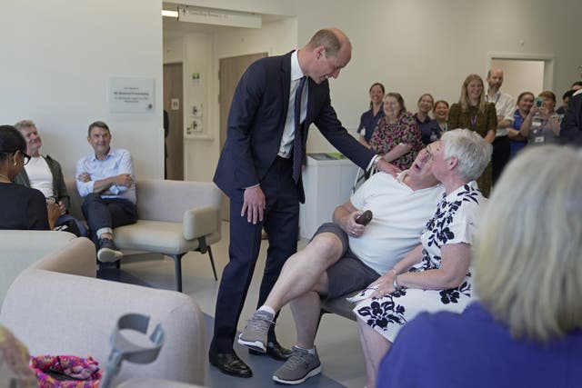 The Prince of Wales, meets outpatients (Kin Cheung/PA)