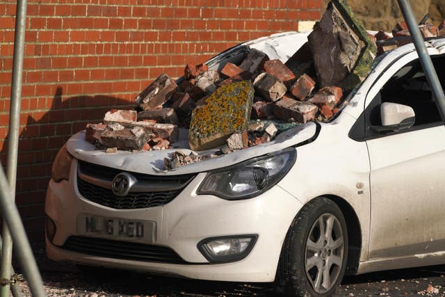 A car crushed by fallen bricks in Seaton Sluice, Northumberland (Owen Humphreys/PA)