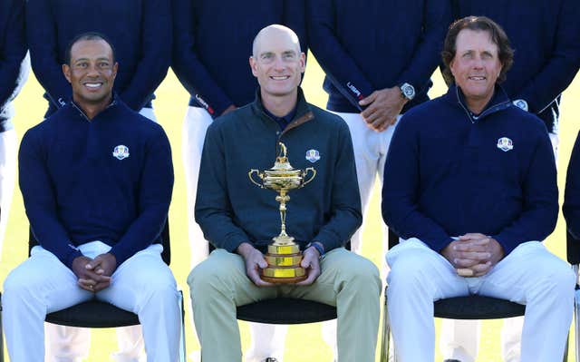 Tiger Woods, left, and Phil Mickelson, right, with Jim Furyk