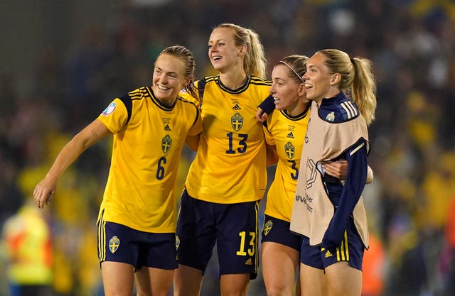 Magdalena Eriksson, left, celebrates with team-mates at full-time, including match-winner Linda Sembrant, second right