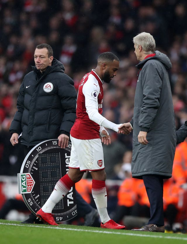 Arsenal’s Alexandre Lacazette shakes hands with his manager Arsene Wenger as he is substituted.