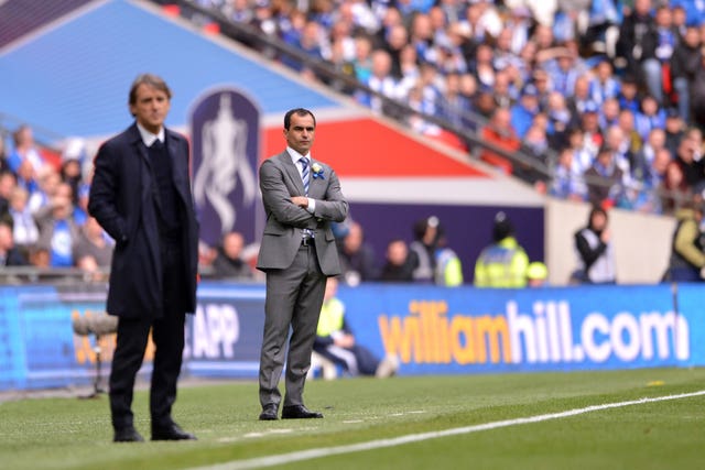 Roberto Mancini, left, and Roberto Martinez suffered different fates after the game