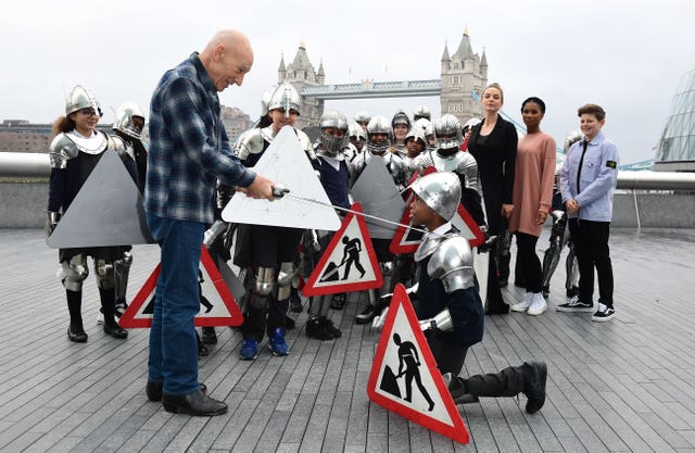 Rebecca Ferguson, Rhianna Dorris and Louis Ashbourne Serkis look on as Sir Patrick Stewart 'knights' pupils