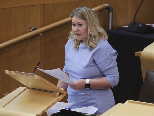 Pauline McNeill standing while speaking in Holyrood