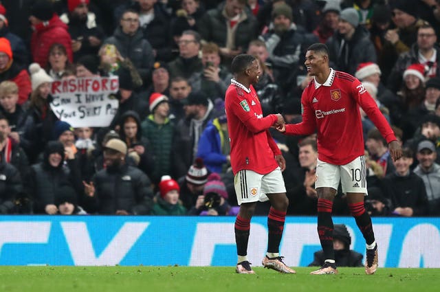 Marcus Rashford (right) celebrates after scoring for United against Burnley on Wednesday (Isaac Parkin/PA).