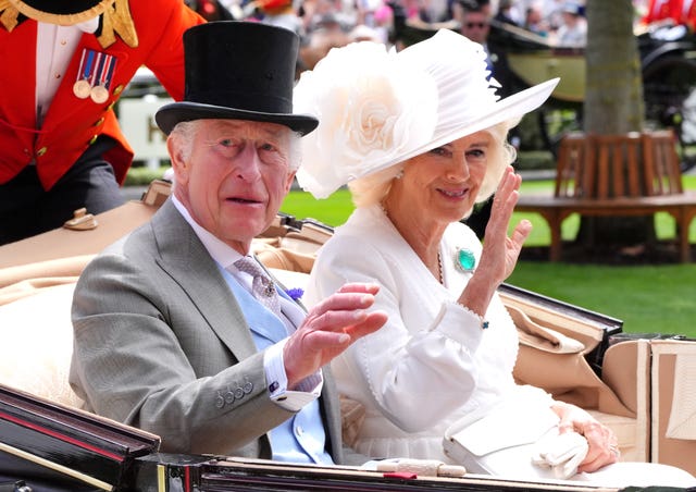 The King and Queen arrive by carriage on day three of Royal Ascot at Ascot Racecourse, Berkshire