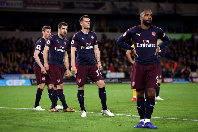 Arsenal’s Laurent Koscielny, Sokratis Papastathopoulos, Granit Xhaka and Alexandre Lacazette stand dejected at full-time