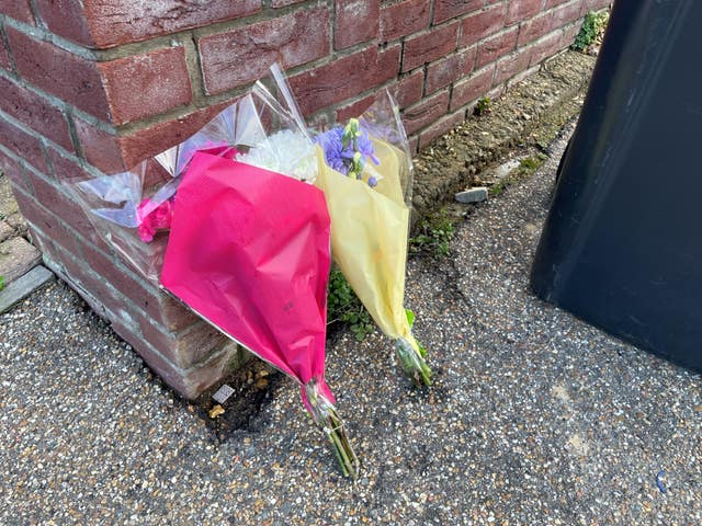 Flowers left at the scene in The Row in Sutton 