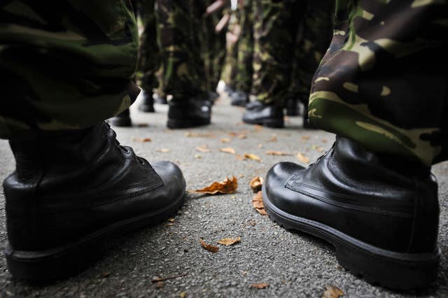 Boots line up in ranks as British Army personnel take part in a rehearsal for a homecoming parade
