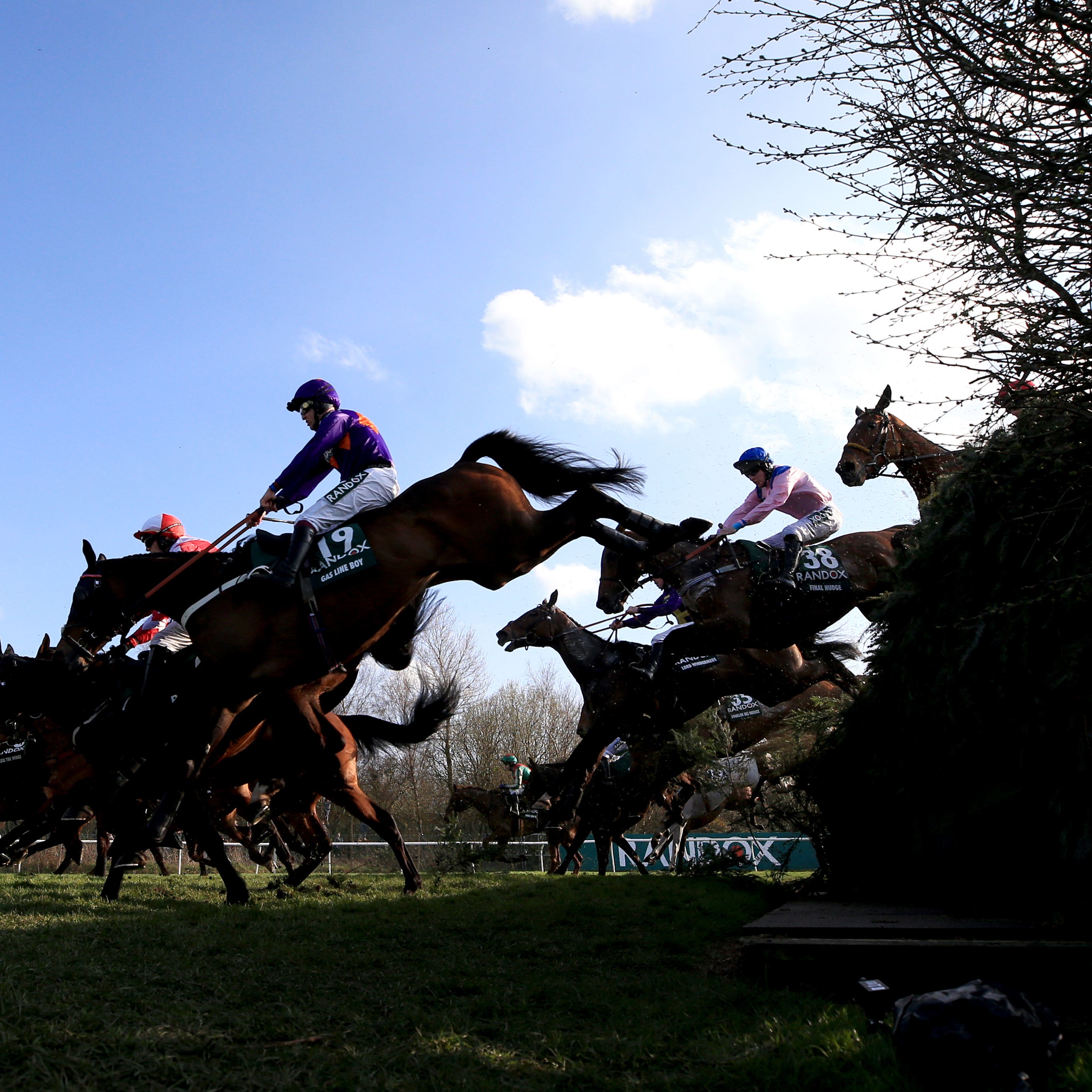 Runners and riders compete in the 2018 Grand National