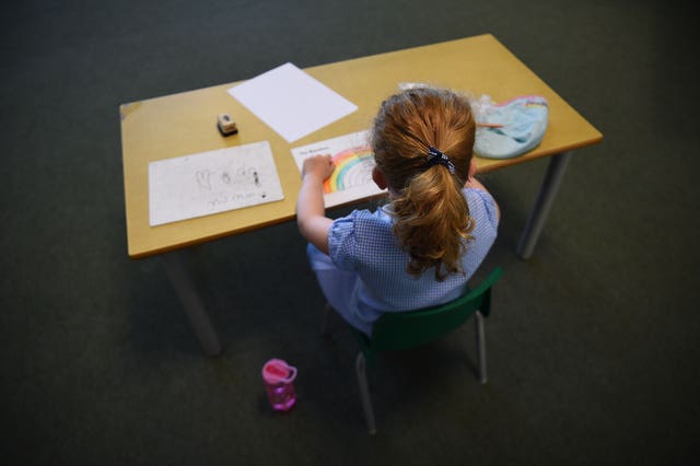 Pupils sit at separate desks at Hiltingbury Infant School in Chandler’s Ford, Hampshire
