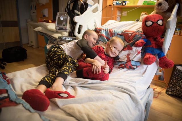 Brothers, four-year-old Ollie (right) and Finley Cripps, six, from Sittingbourne, Kent, at the Royal Marsden hospital in Surrey, after Finley donated his stem cells to his brother (Stefan Rousseau/PA)
