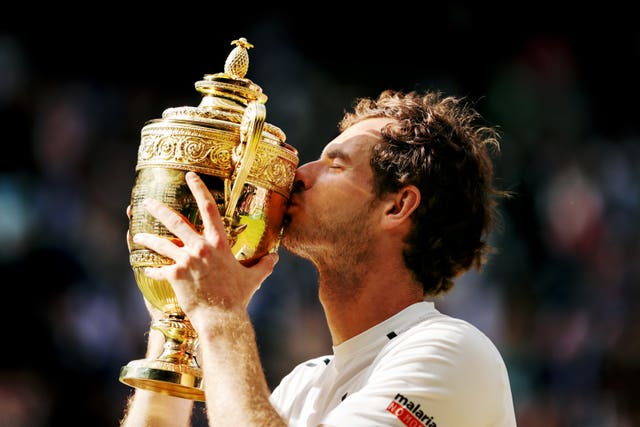 Andy Murray kisses the Wimbledon trophy 