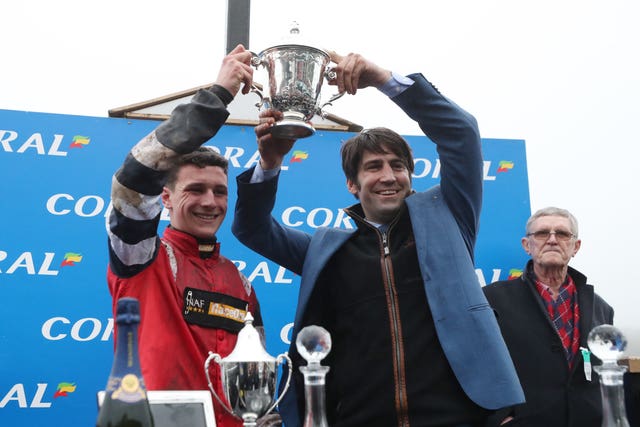 Jack Tudor celebrates his victory on Potters Corner in the Coral Welsh Grand National Handicap Chase with trainer Christian Williams