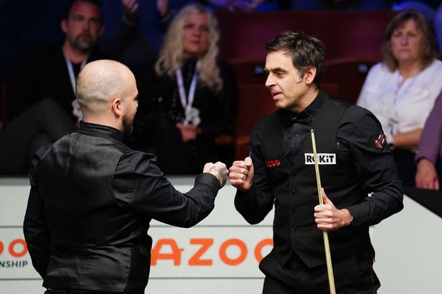 Ronnie O’Sullivan congratulates Luca Brecel (left) after their World Championship quarter-final