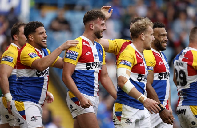 Joshua Rourke, centre, is congratulated after scoring for London Broncos against Hull FC at Magic Weekend