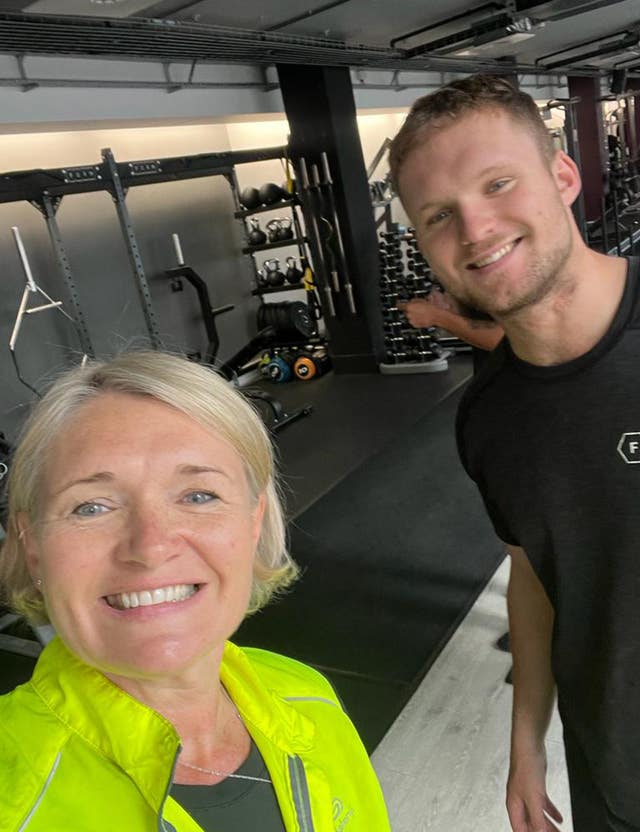 Kate and Archie Vokes smile in a gym