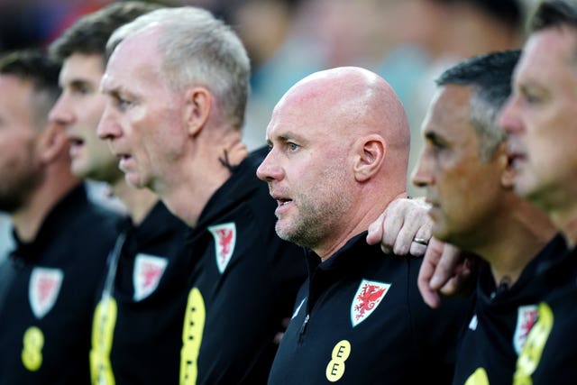 Rob Page, centre, and his coaching team