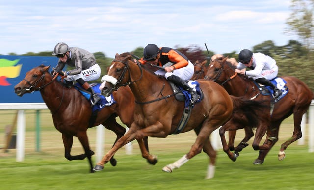 Raasel (centre) winning the Coral Charge during in 2022