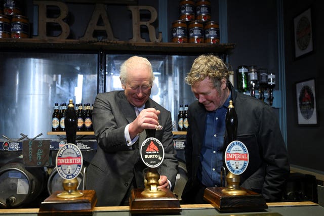 The King pulls a pint of beer