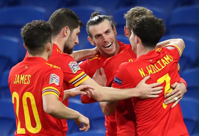 Wales’ Gareth Bale (centre) celebrates the opening goal with his team-mates
