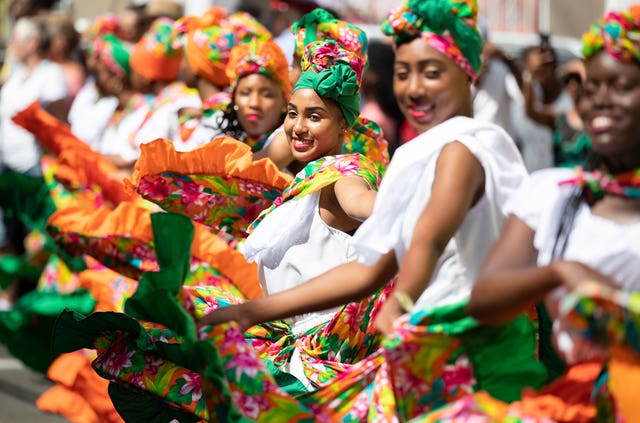 Dancers line the streets in Grenada