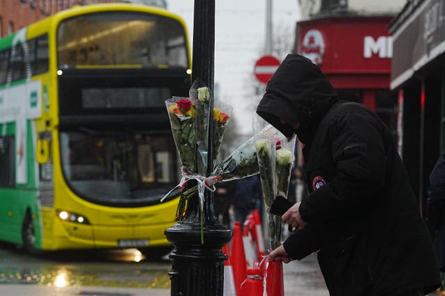 Flowers left at the scene of the collision