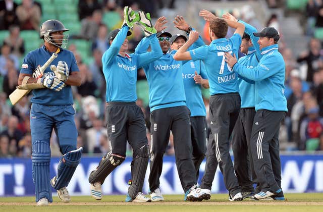 Gurney, third right, celebrates taking the wicket of Kumar Sangakkara for England
