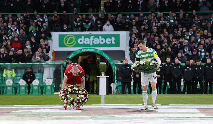 Aberdeen's Scott Brown and Celtic's Callum McGregor lays a wreath in respect of Bertie Auld before the match at Celtic Park