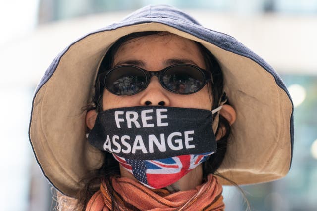 Supporters of Wikileaks founder Julian Assange protest outside the Home Office in London with campaigners, to mark his birthday. 