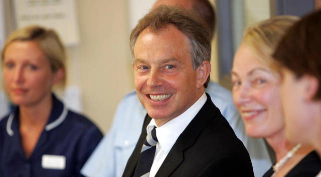 Tony Blair listens to staff at Frimley Park Hospital in Surrey when he was prime minister (Tim Ockenden/PA)