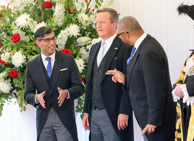 Rishi Sunak, Lord Cameron and James Cleverly stand together dressed in morning dress