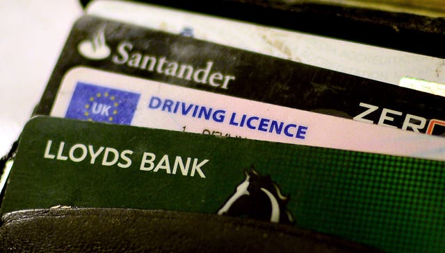 A driving licence and bank cards in a wallet