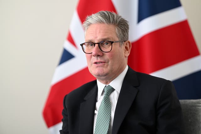 Sir Keir Starmer sits in front of a union jack during a bilateral meeting with the president of Kenya