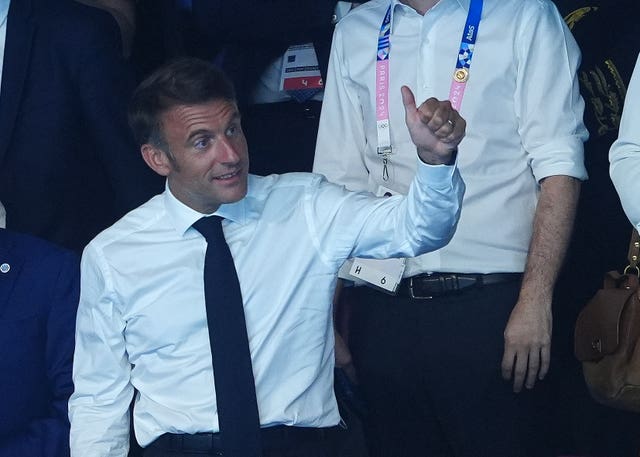 France President Emmanuel Macron at La Defense Arena to watch Leon Marchand