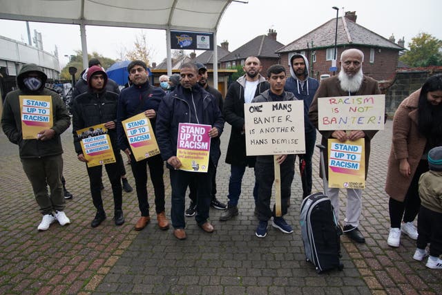 People take part in a protest outside Yorkshire's stadium Headingley