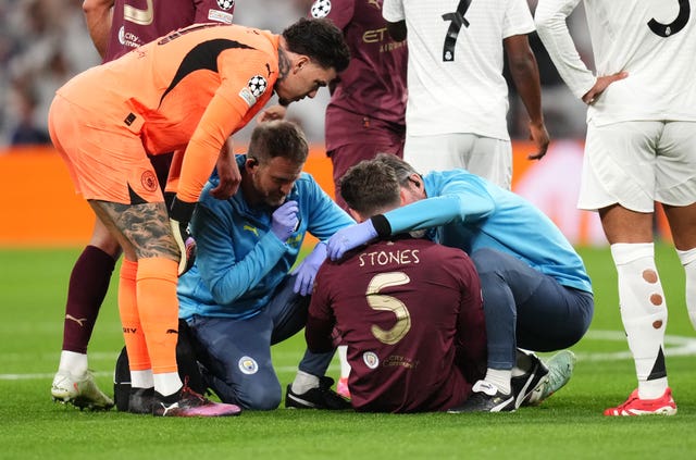 Manchester City’s John Stones receives treatment before leaving the game with an injury