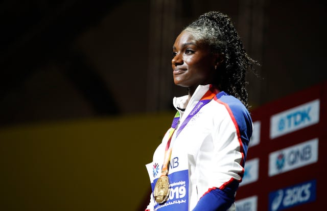 Dina Asher-Smith on the podium after receiving her 200m gold medal at the 2019 World Championships in Doha