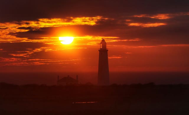 St Mary's Lighthouse in Whitley Bay, Northumberland, as the old adage of red sky in morning, shepherd's warning, was proved wrong (Owen Humphreys/PA)