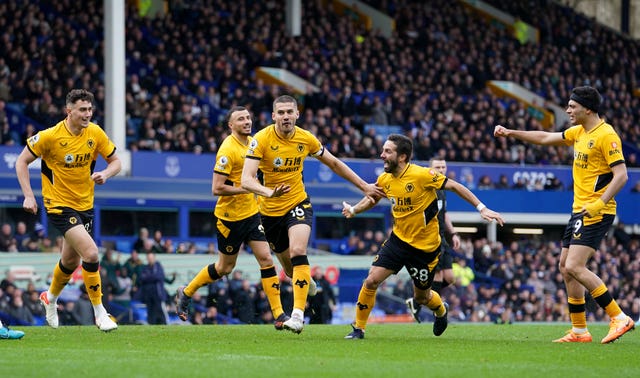 Conor Coady, centre, celebrates scoring Wolves' winner at Everton